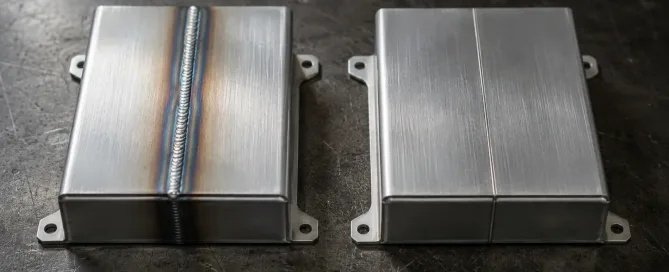 Side-by-side comparison of TIG welding arc and laser welding beam on aluminum enclosure panels