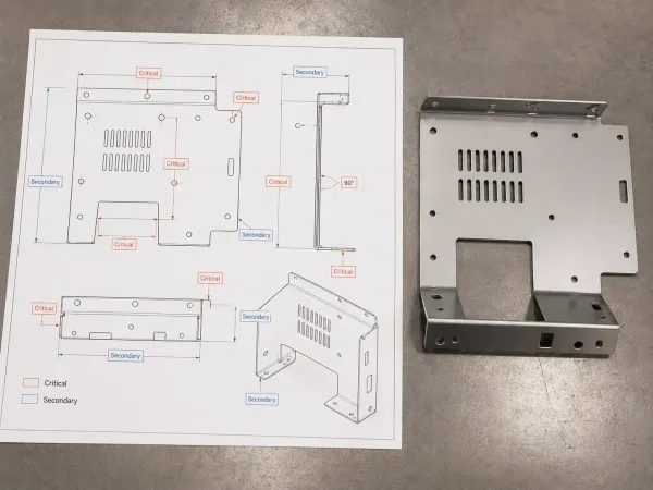 Critical and secondary dimensions on a sheet metal part drawing