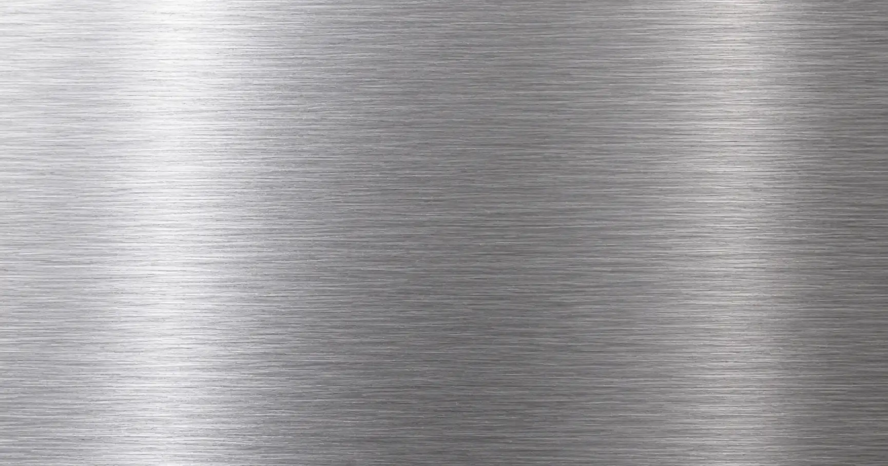 Brushed stainless steel sheet metal surface showing parallel grain texture lines