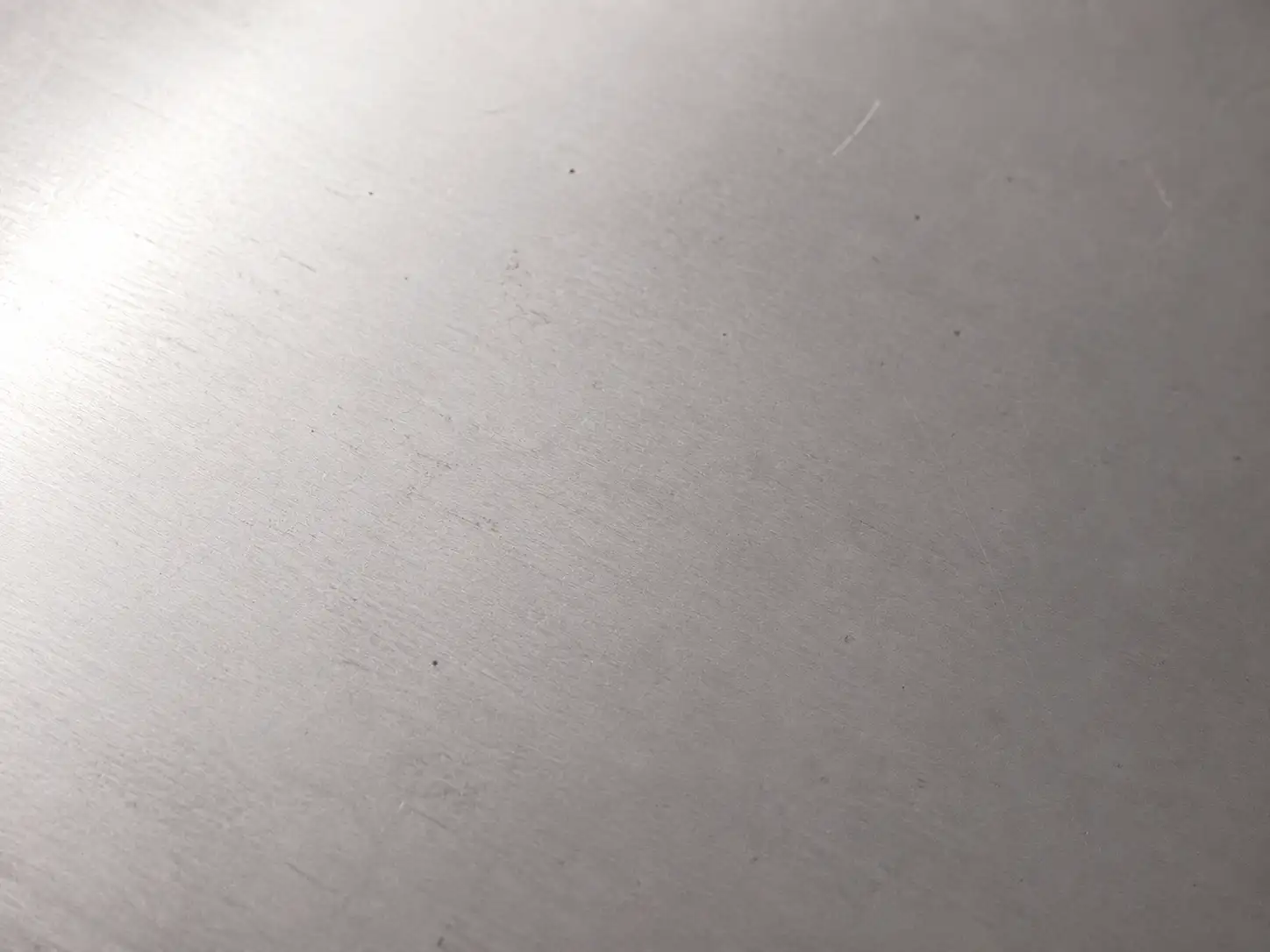 Permissible Surface Defects on Cold-Rolled Steel Cold-rolled carbon steel sheet showing minor scratches, indentations and light surface imperfections